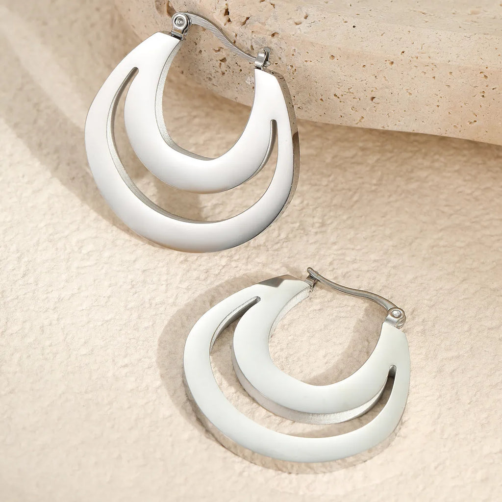 Geometric gold plated French earrings with round ring elements on stainless steel