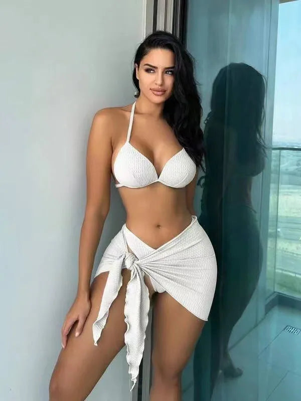 Women's black three-piece swimsuit set showing top, bikini bottoms, and skirt with Russian split style