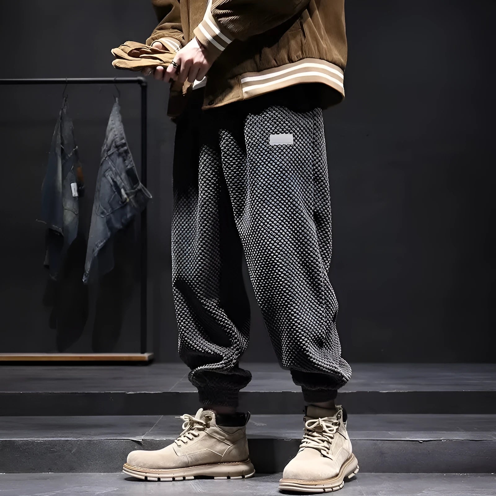 Men's grey straight-leg sweatpants with an adjustable ankle strap, laid flat.