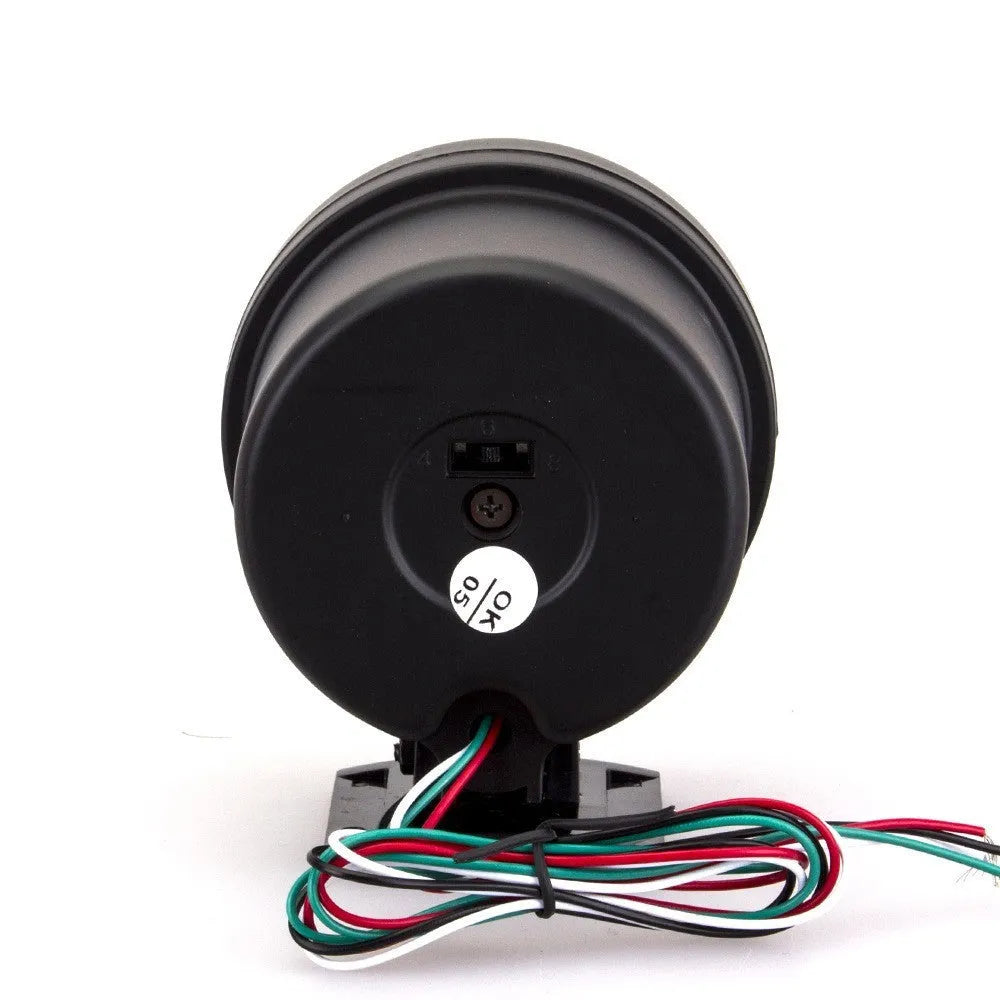 Black universal automotive tachometer with blue light pointer and scale showing rpm.
