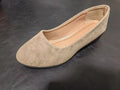 Women's plus size suede wedge pumps in light brown with a low rubber heel and round toe.