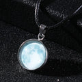 Close-up of a luminous constellation model glass pendant on an alloy necklace chain with extension.
