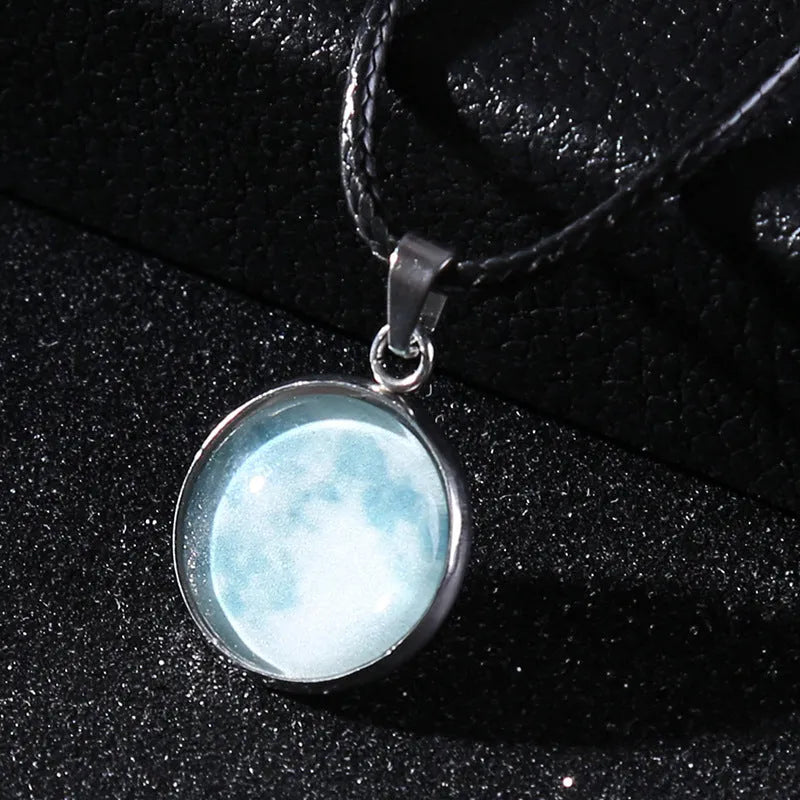 Close-up of a luminous constellation model glass pendant on an alloy necklace chain with extension.