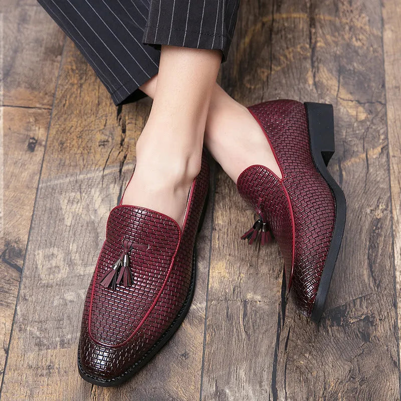 Men's black pointed toe slip-on shoes with a tassel, made from artificial PU leather.