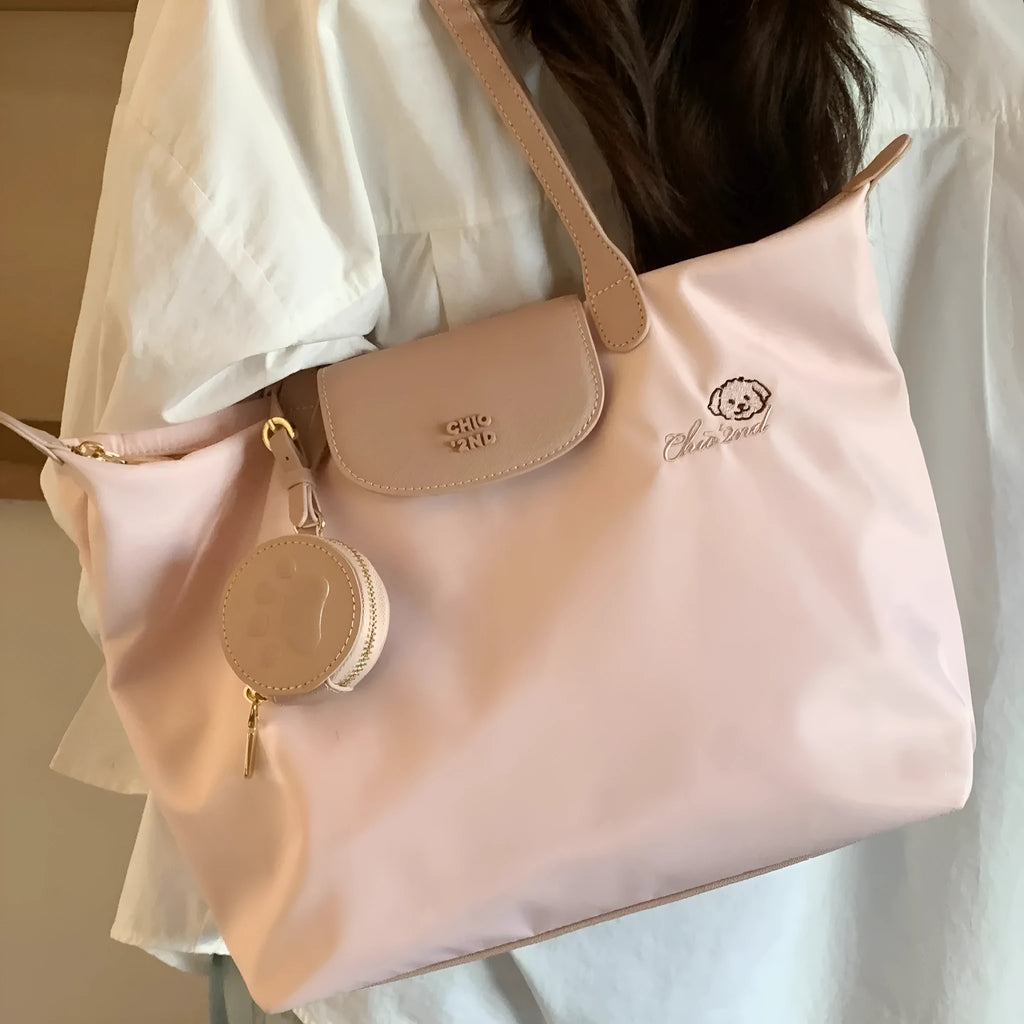 Pink Oxford cloth shoulder bag with horizontal square shape and sandwich pocket design