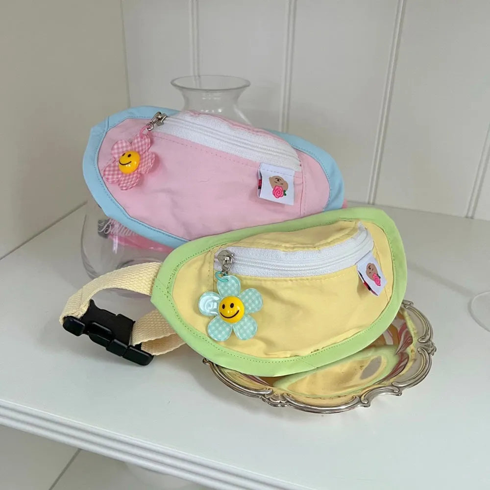 Backpack-style poop bag dispenser for dogs and cats in powder blue with adjustable messenger bag straps