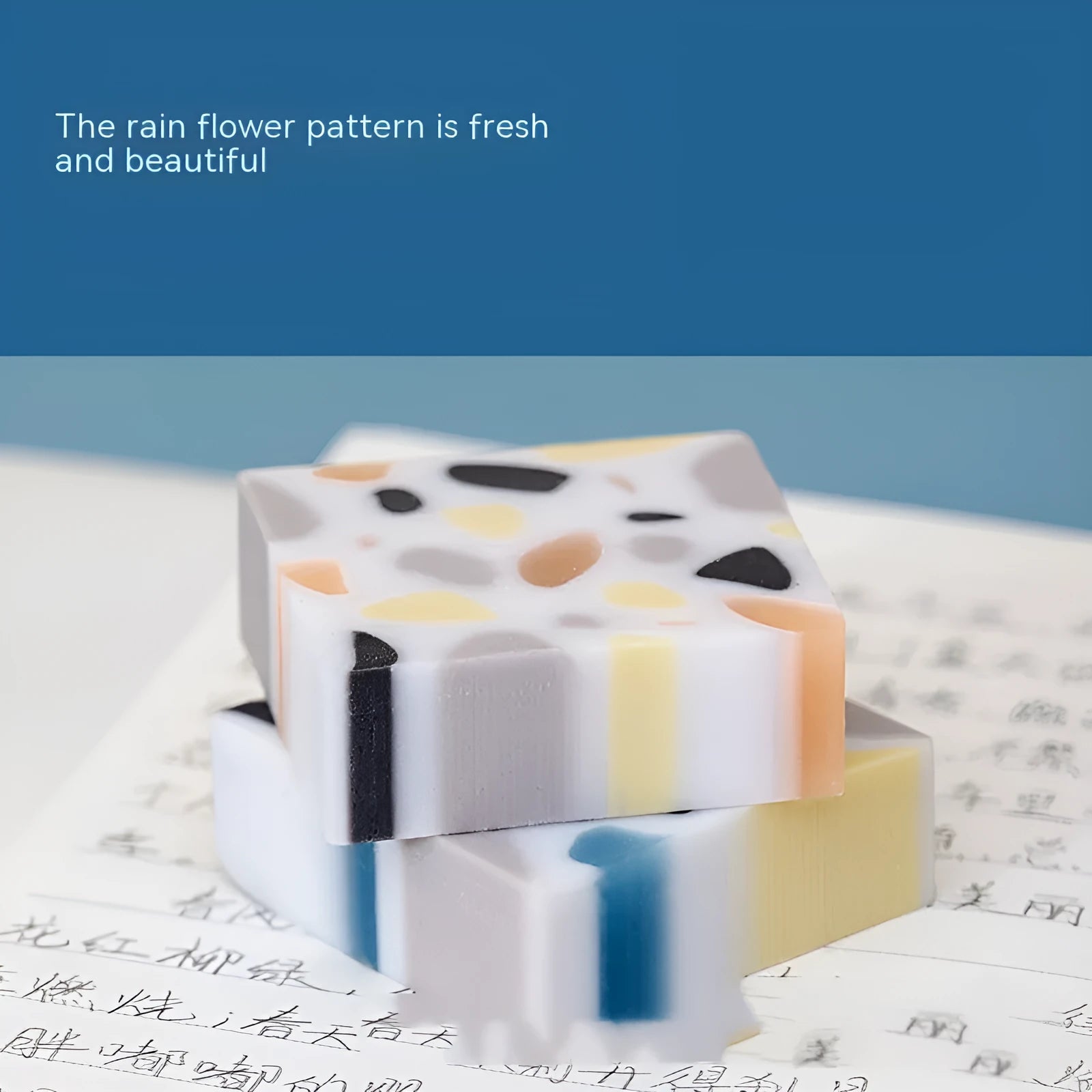 A single brick-shaped white rubber eraser for removing pencil marks.