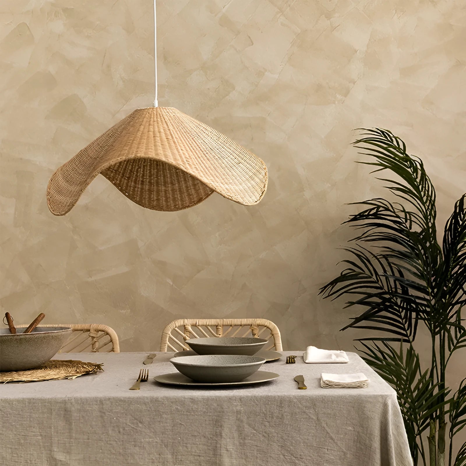 Handwoven natural rattan and willow bamboo chandelier with warm white LED light in three size diameters.