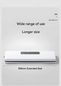 White compact automatic vacuum sealer machine for household food preservation on a kitchen counter.