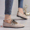 Beige leopard print women's pumps with a pointed toe, shown in a plus size.