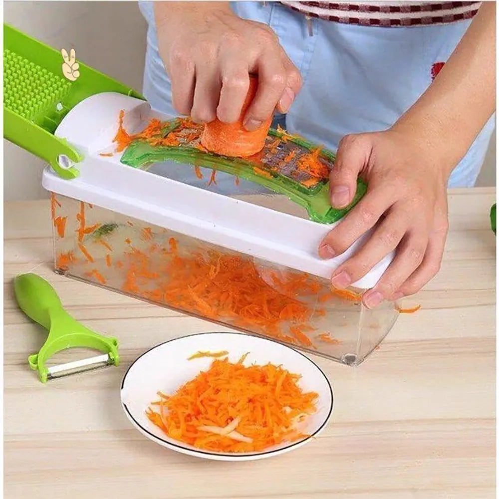 Green manual food chopper with stainless steel blades and plastic body on a kitchen worktop.