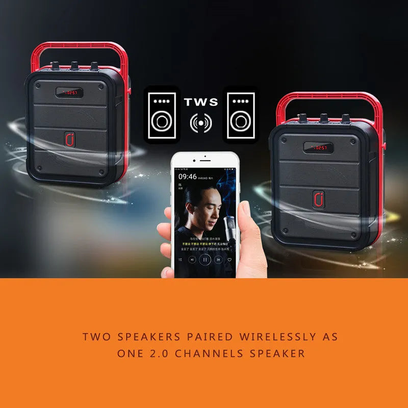 Portable black Bluetooth speaker with a wireless microphone, remote control, and carry strap.