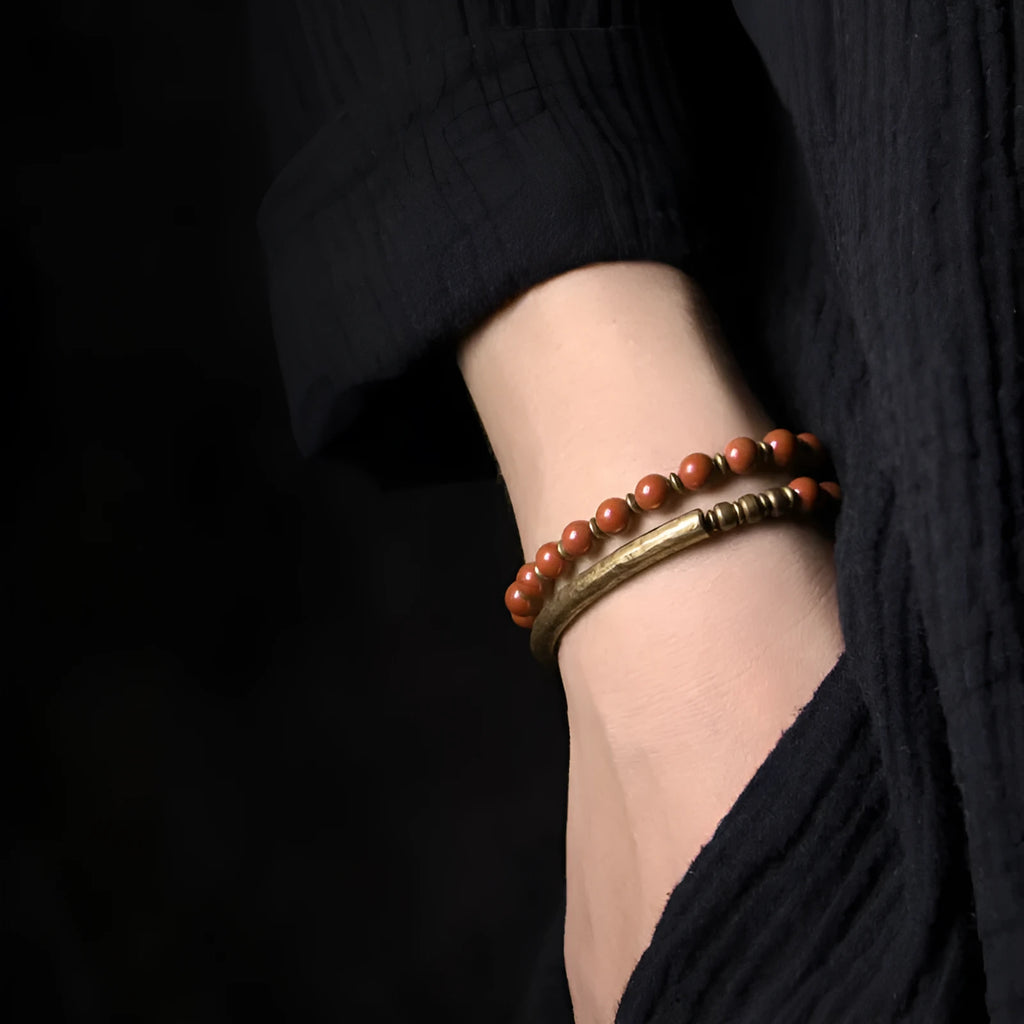 Layered retro ethnic beaded bracelet made from natural stone and brass for men and women.