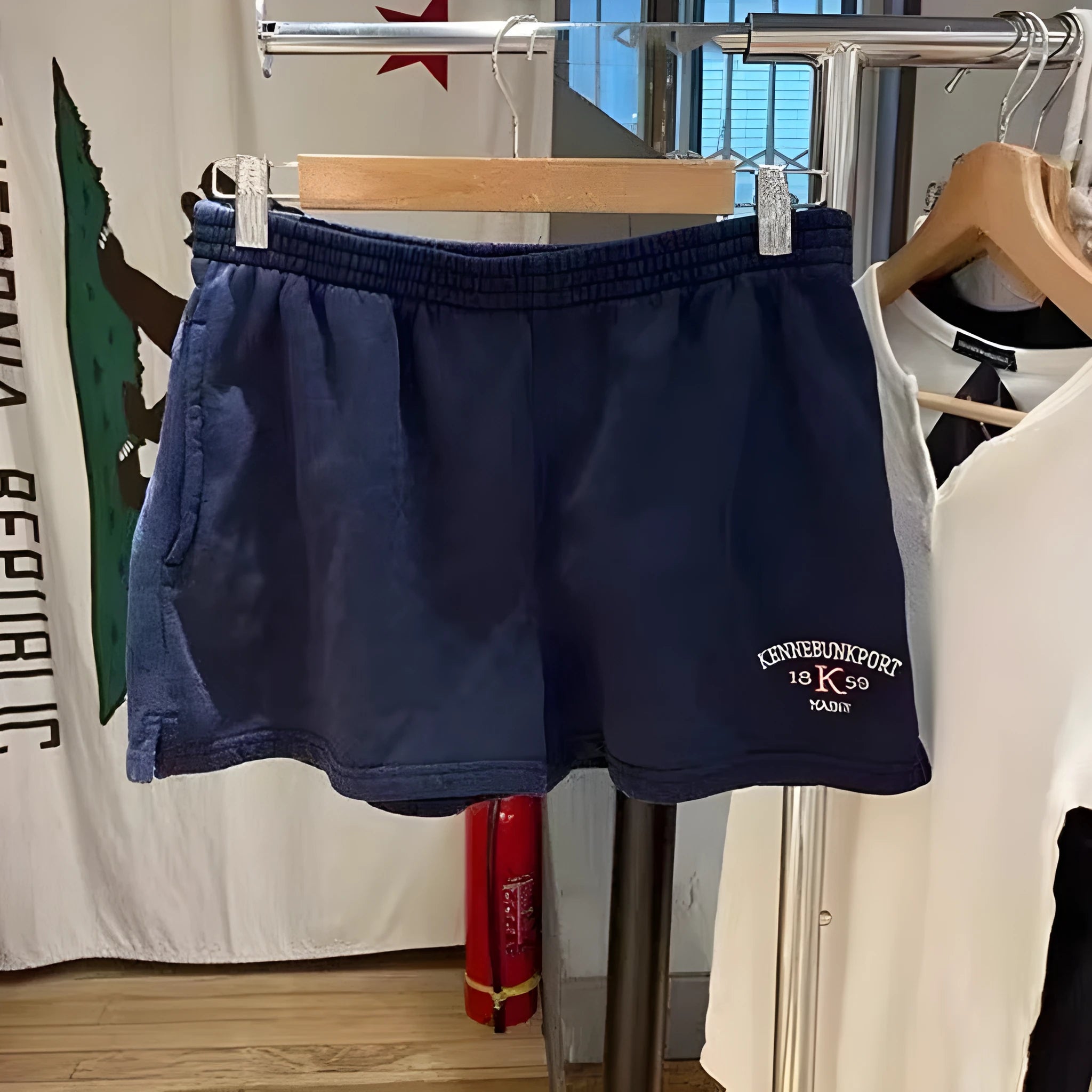 Women's dark blue cotton sports shorts with white flag embroidery and high-top design