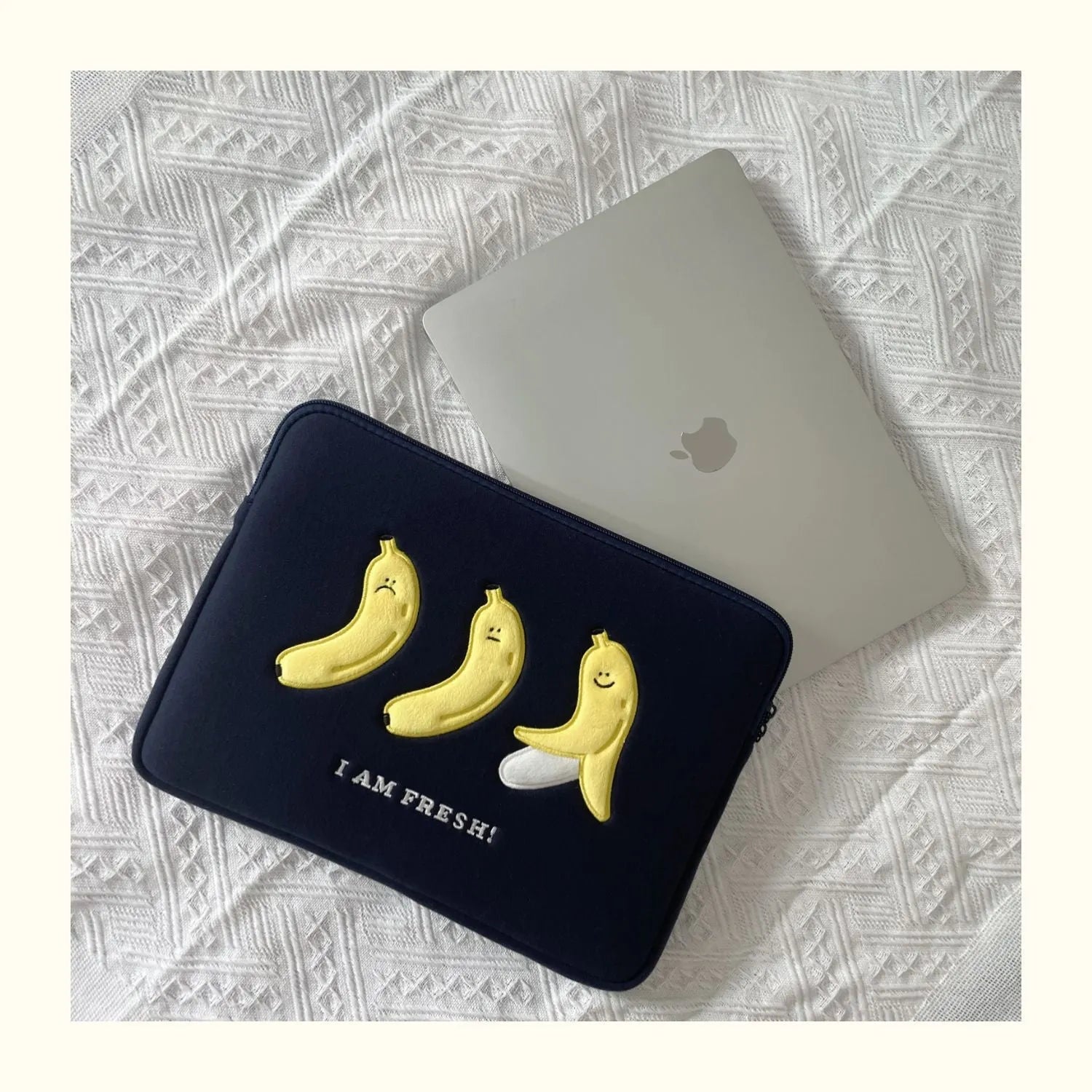Colourful embroidered laptop sleeve with animal design for a 15.6-inch laptop.