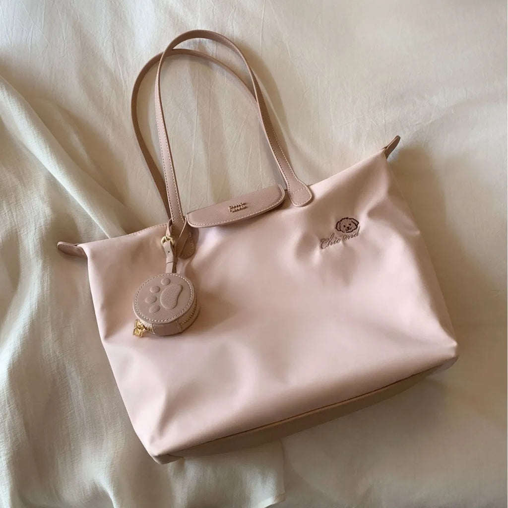 Pink Oxford cloth shoulder bag with horizontal square shape and sandwich pocket design