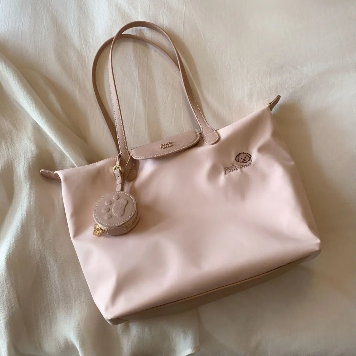 Pink Oxford cloth shoulder bag with horizontal square shape and sandwich pocket design