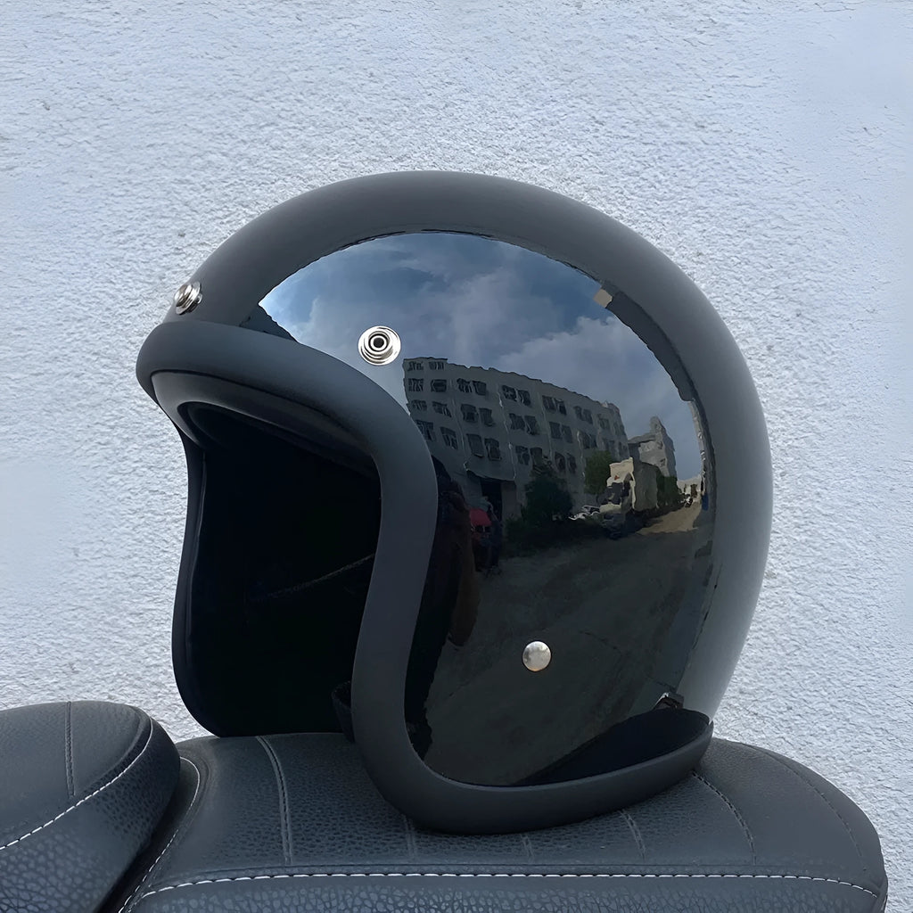 Retro-style fibreglass motorcycle half helmet shown in cement grey colour option