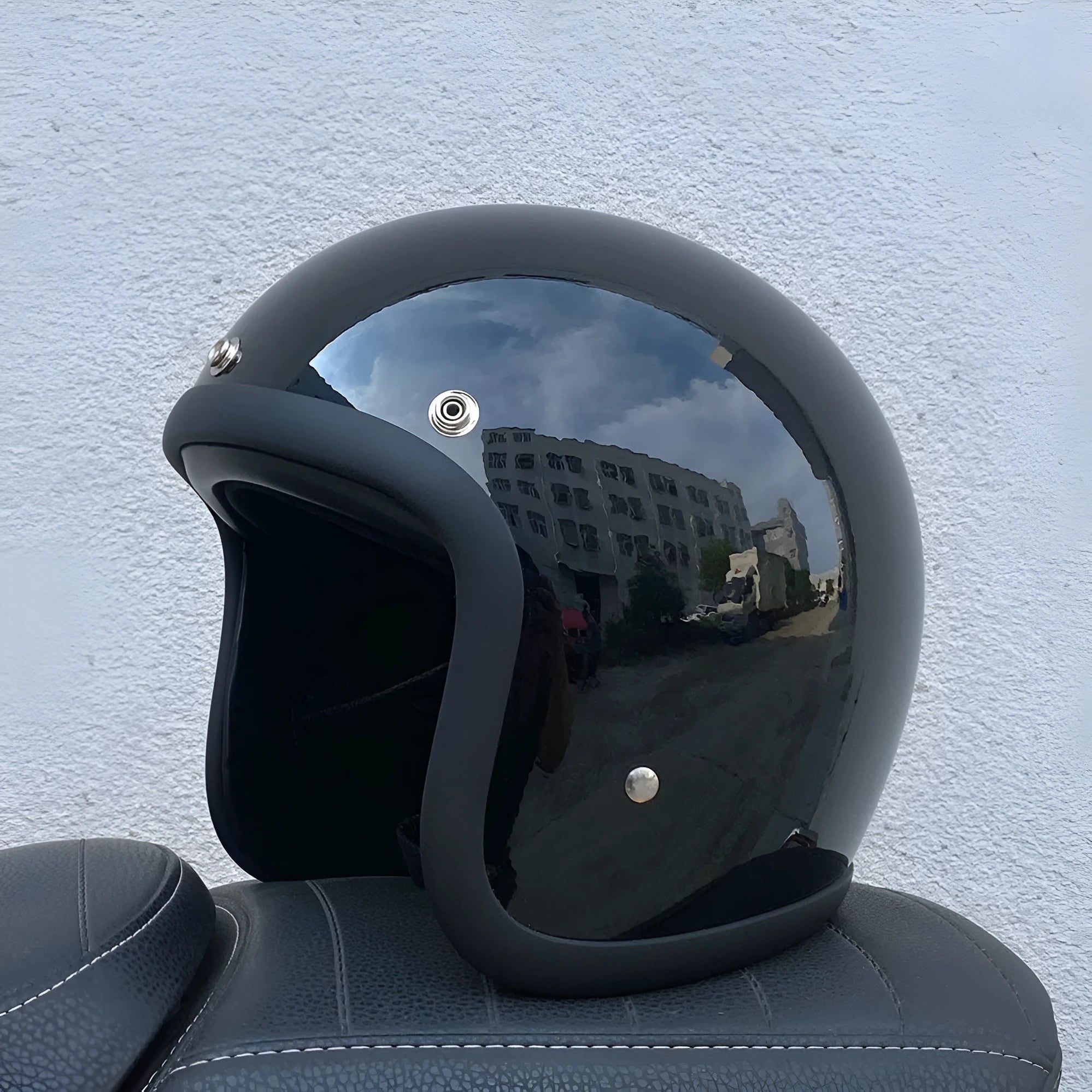 Retro-style fibreglass motorcycle half helmet shown in cement grey colour option