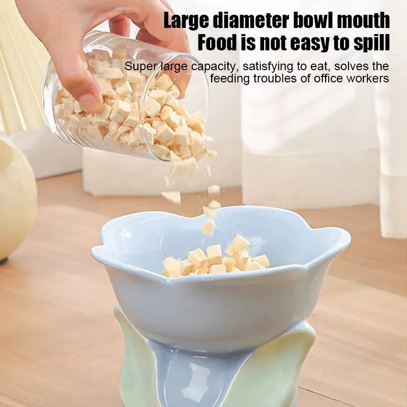 Blue ceramic elevated pet bowl with floral pattern and non-slip base for cats and small dogs