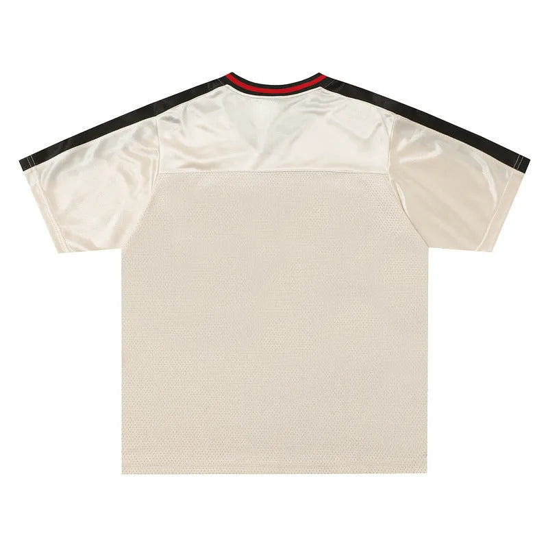 Apricot coloured V-neck pullover top with loose fit and drop shoulder short sleeves.