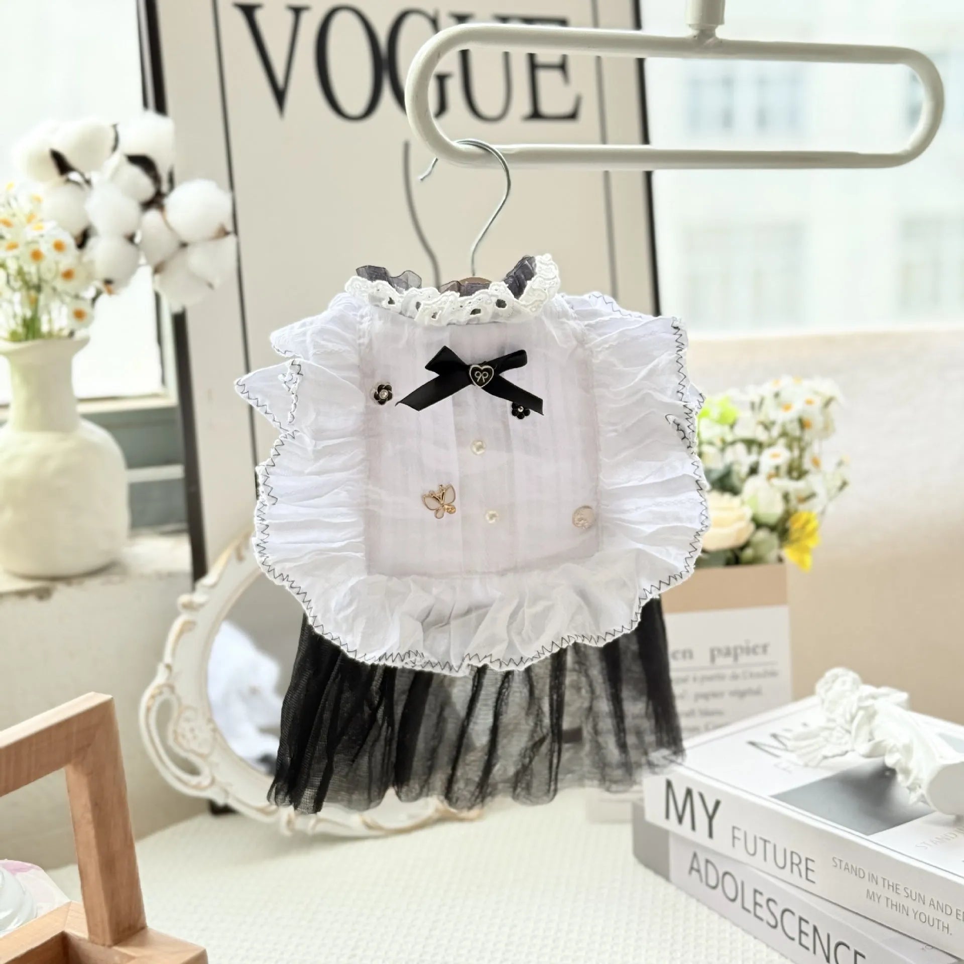 White yarn princess-style gauze skirt for small to medium dogs on mannequin showing chest and length measurements
