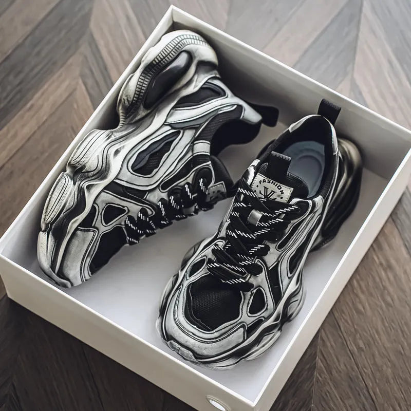 Men's black mesh sneaker with platform sole and lace-up front, showing cross-belt detail and round toe.