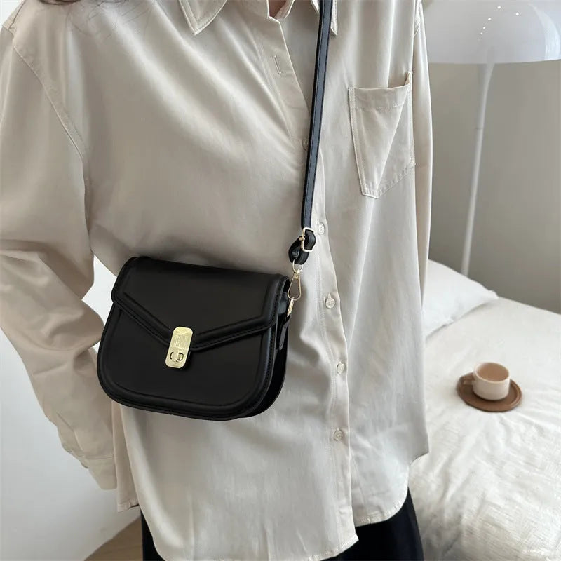 Soft niche texture PU messenger bag in horizontal square clamshell design shown in black colour.