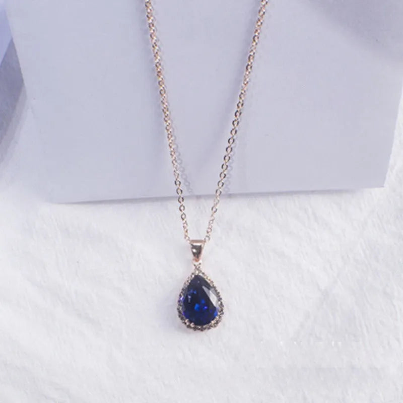 Women's rose gold electroplated rhinestone necklace with geometric water drop pendant in pink colour