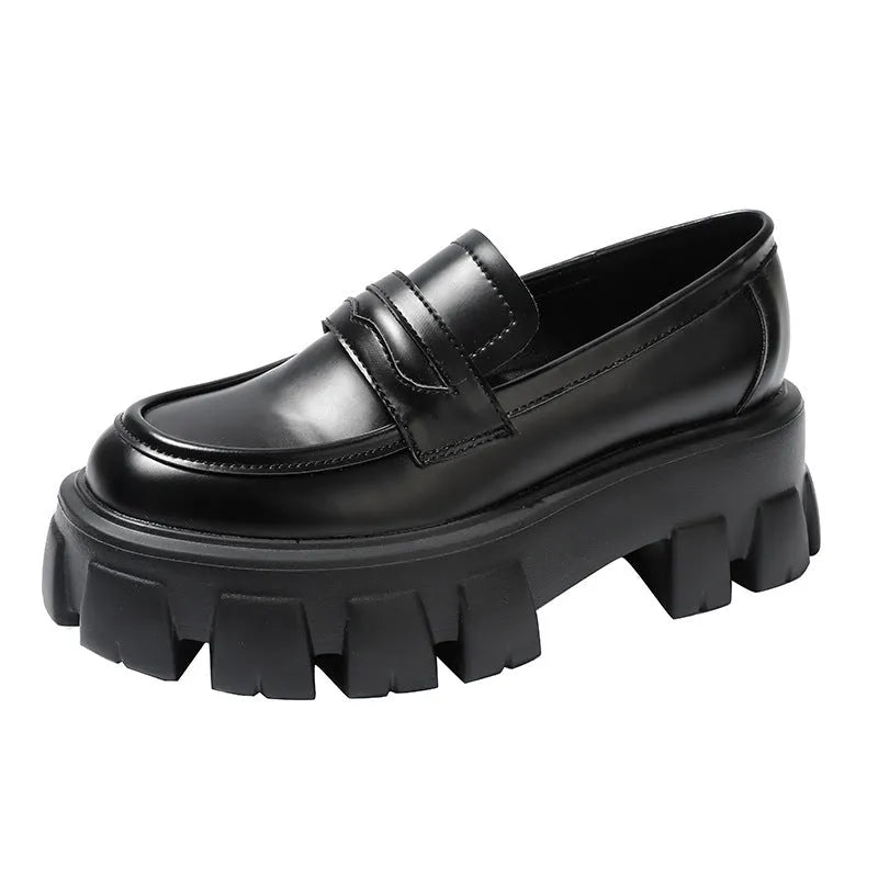 A pair of British style wide fit loafers with a shallow opening, shown in a choice of matte or glossy patent leather.