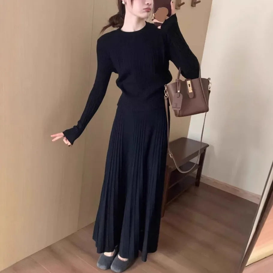Dark grey knitted women's long dress suit with sweater, skirt, and 3D artistic pattern.