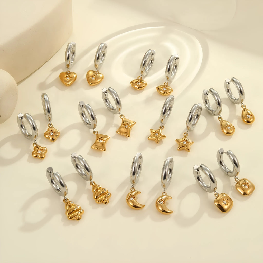Women's stainless steel Christmas tree earrings with 18K electroplated finish showing heart and star shapes