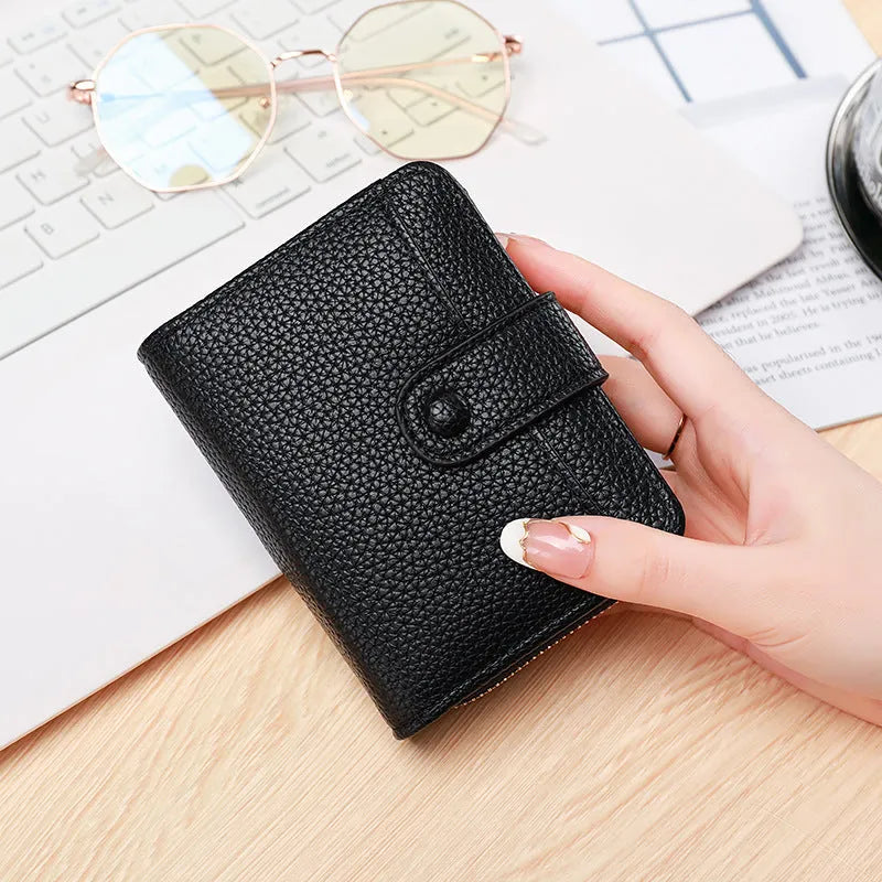 Women's Lychee pattern organ short wallet in breathable antibacterial PU, shown in beige, pink, black, and red colour options.