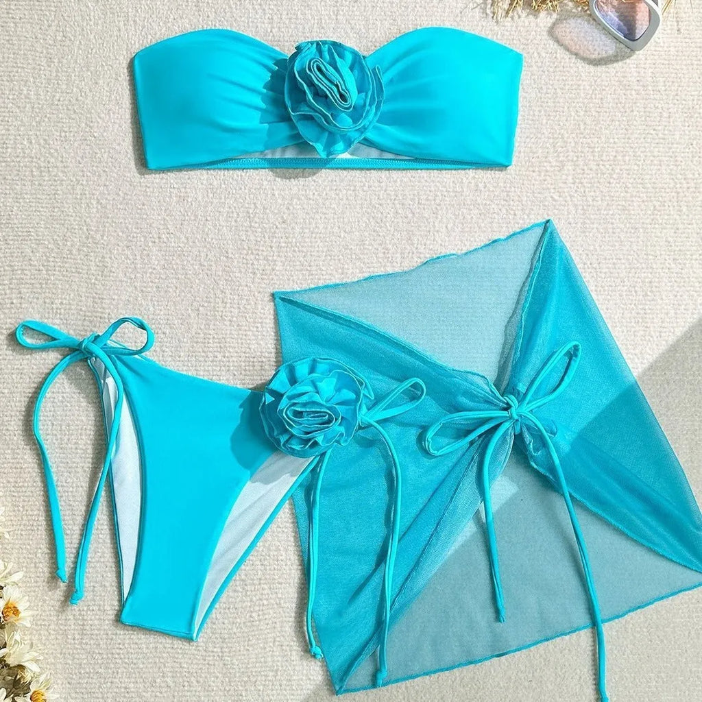 Women's blue tube top swimsuit with large 3D flower tie, matching pants and skirt