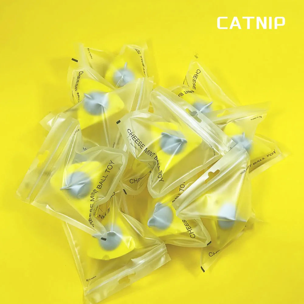 Yellow natural catnip chew toy balls for cats on a plain background.