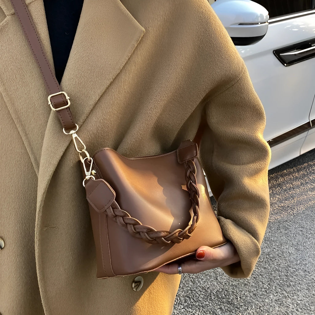 Retro woven PU leather crossbody bucket bag in khaki colour showing bucket shape and shoulder strap