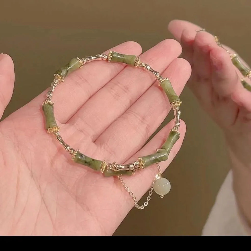 Women's plum wine coloured bamboo joint beaded bracelet with a glossy glaze finish.