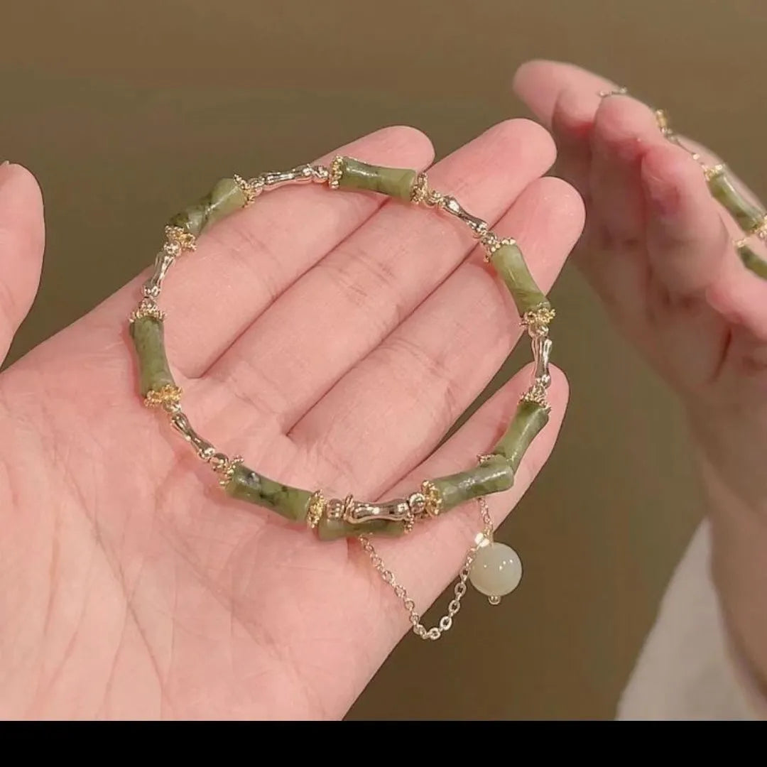 Women's plum wine coloured bamboo joint beaded bracelet with a glossy glaze finish.