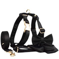 Cloth dog collar and harness set with matching leash, red bow accessory, and coordinating dog vest.