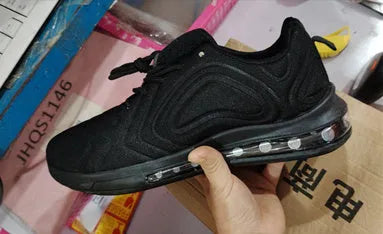 Men's black casual running sneakers with air cushion, lace-up front, and thick sole.