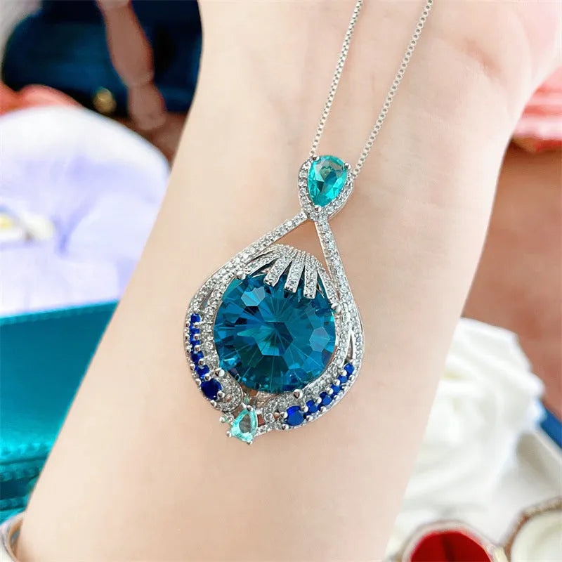 Blue geometric crystal pendant necklace with water wave chain and fireworks-cut gems
