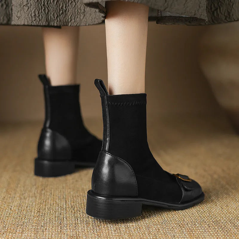 Women's black low heel Martin boots with buckle stitching and front lace-up fastening on a round toe.