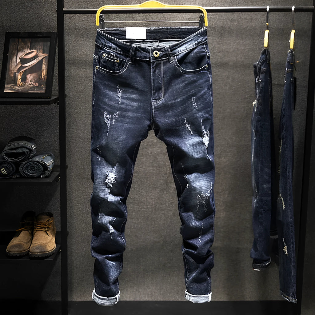 Men's dark blue skinny jeans with a slim fit, shown on a model.