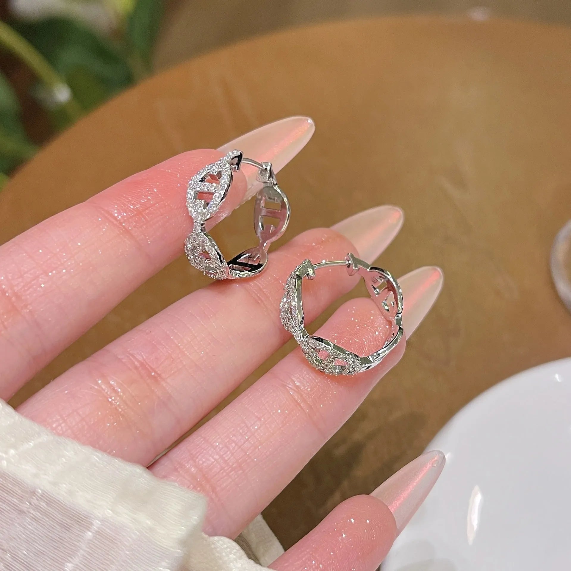 Women's diamond design electroplated earrings in silver, gold, and rose gold colour variations