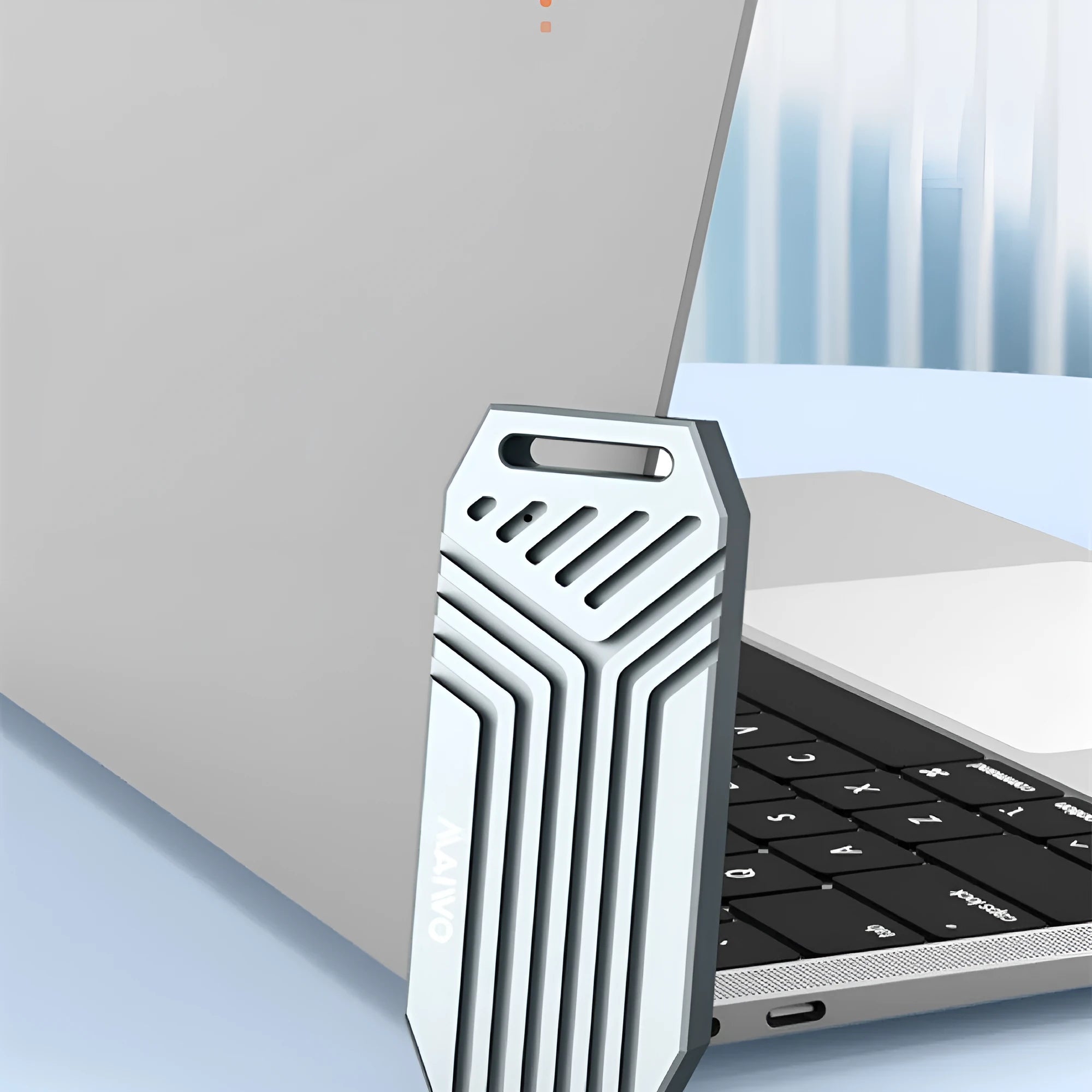Silver aluminium Thunderbolt 4 external SSD enclosure for M.2 NVMe drives, showing compact size.