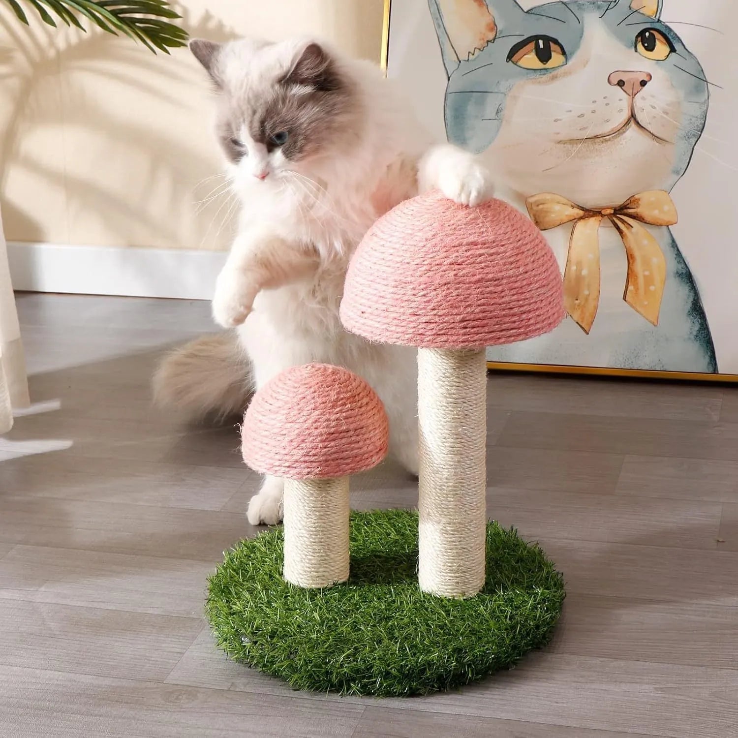 Pink mushroom-shaped cat scratching post with sisal-covered pole and caps on a sturdy base.