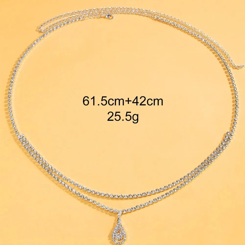 Gold and silver water drop pendant waist chain for women with rhinestones and tassel detailing.
