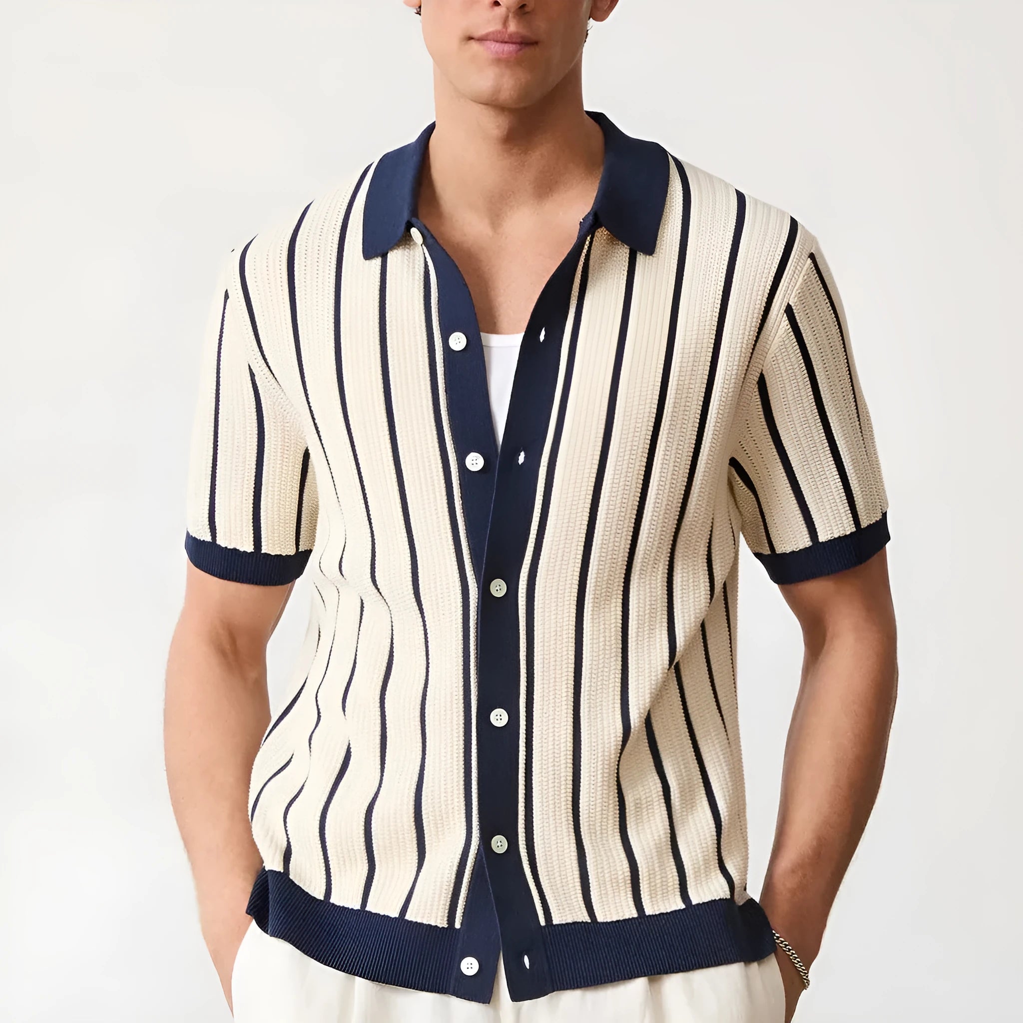 Men's white knitted short sleeve top with a lapel collar and asymmetric British style design