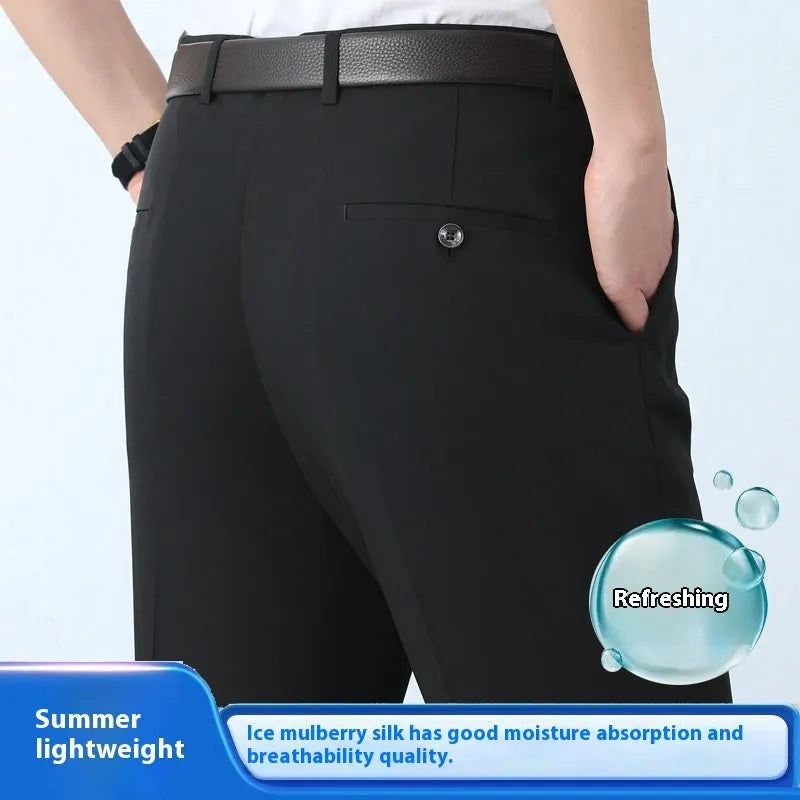 Men's straight-leg suit trousers in a dark blue colour, showing high waist and business cut.
