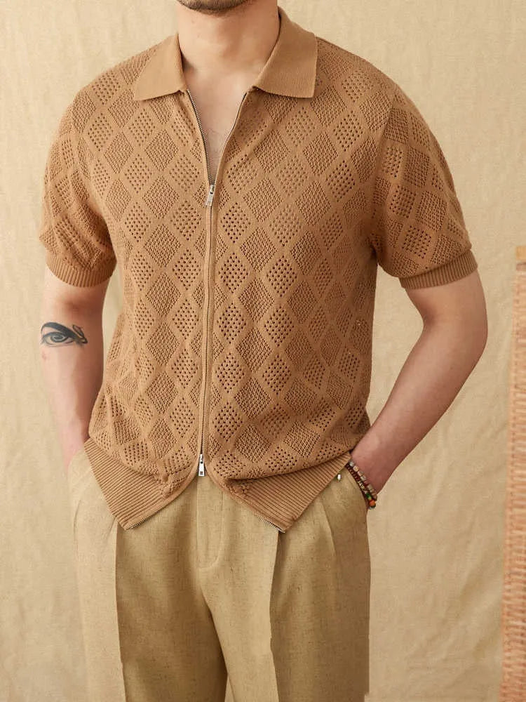Front view of a white cotton cardigan with a zipper and lapel collar.
